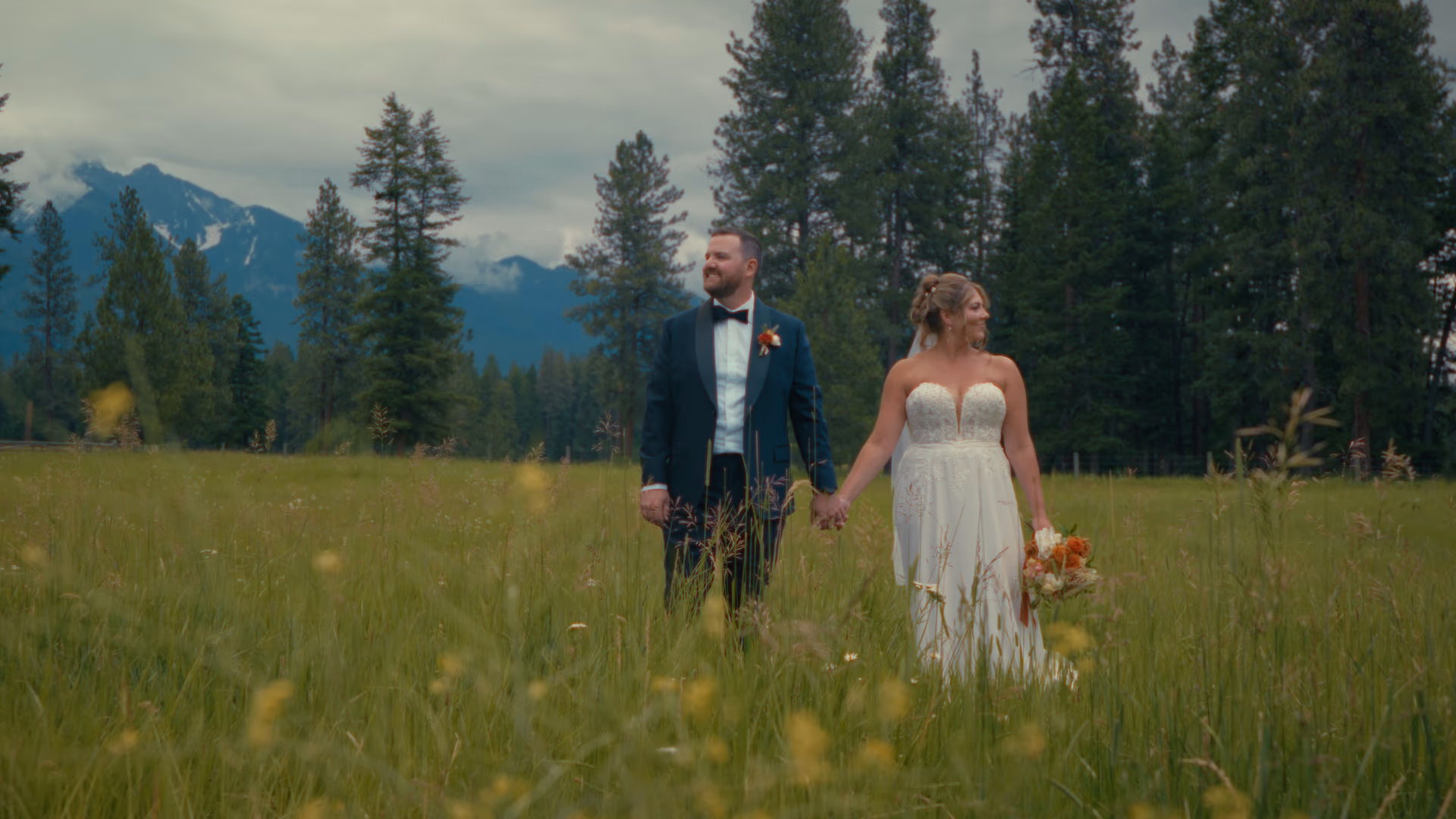 Meagan and Kenley's wedding at The Silver Knot in Ronan Montana with the Mission Mountains behind them