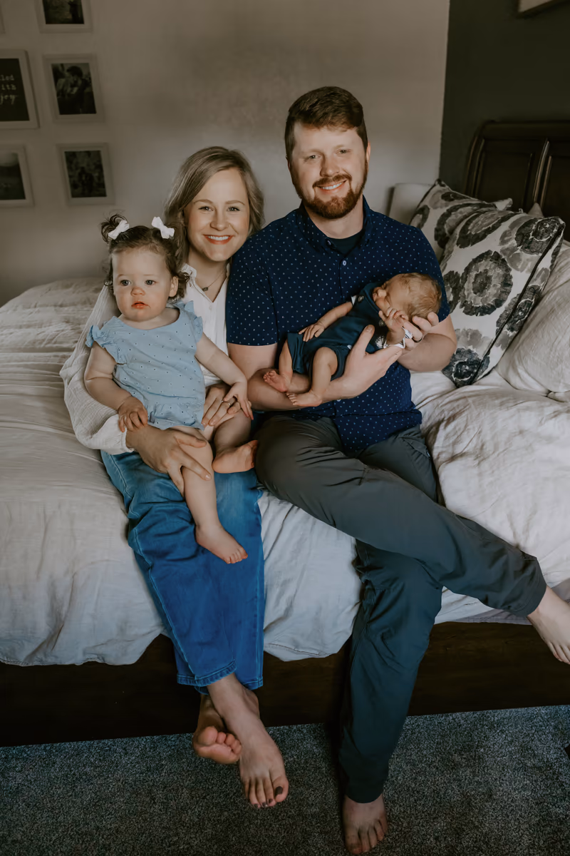 Montana wedding videographer Skeeter Johnston at home with his wife, daughter, and newborn son